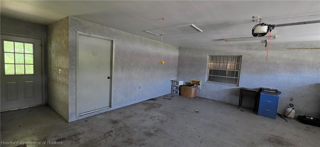 307 Southwest 10th Street Okeechobee, FL 34974 - Photo 11 of 38 seperate storage room inside garage
