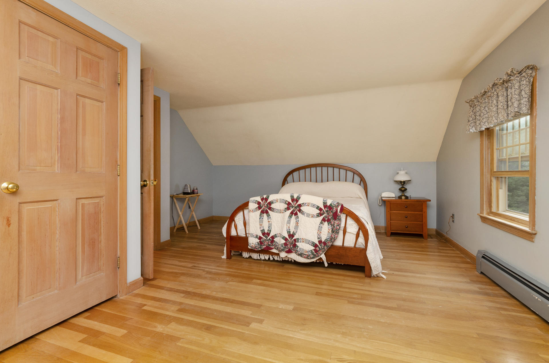 236 Old Mill Road Marstons Mills, MA 02648 - Photo 16 of 20 a view of a bedroom with wooden floor and windows