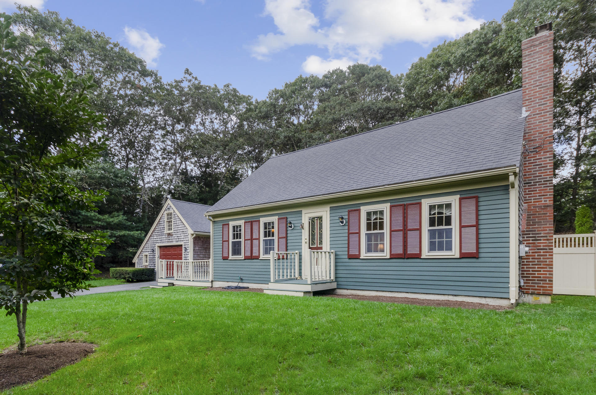 236 Old Mill Road Marstons Mills, MA 02648 - Photo 2 of 20 a view of a house with a yard and a garden