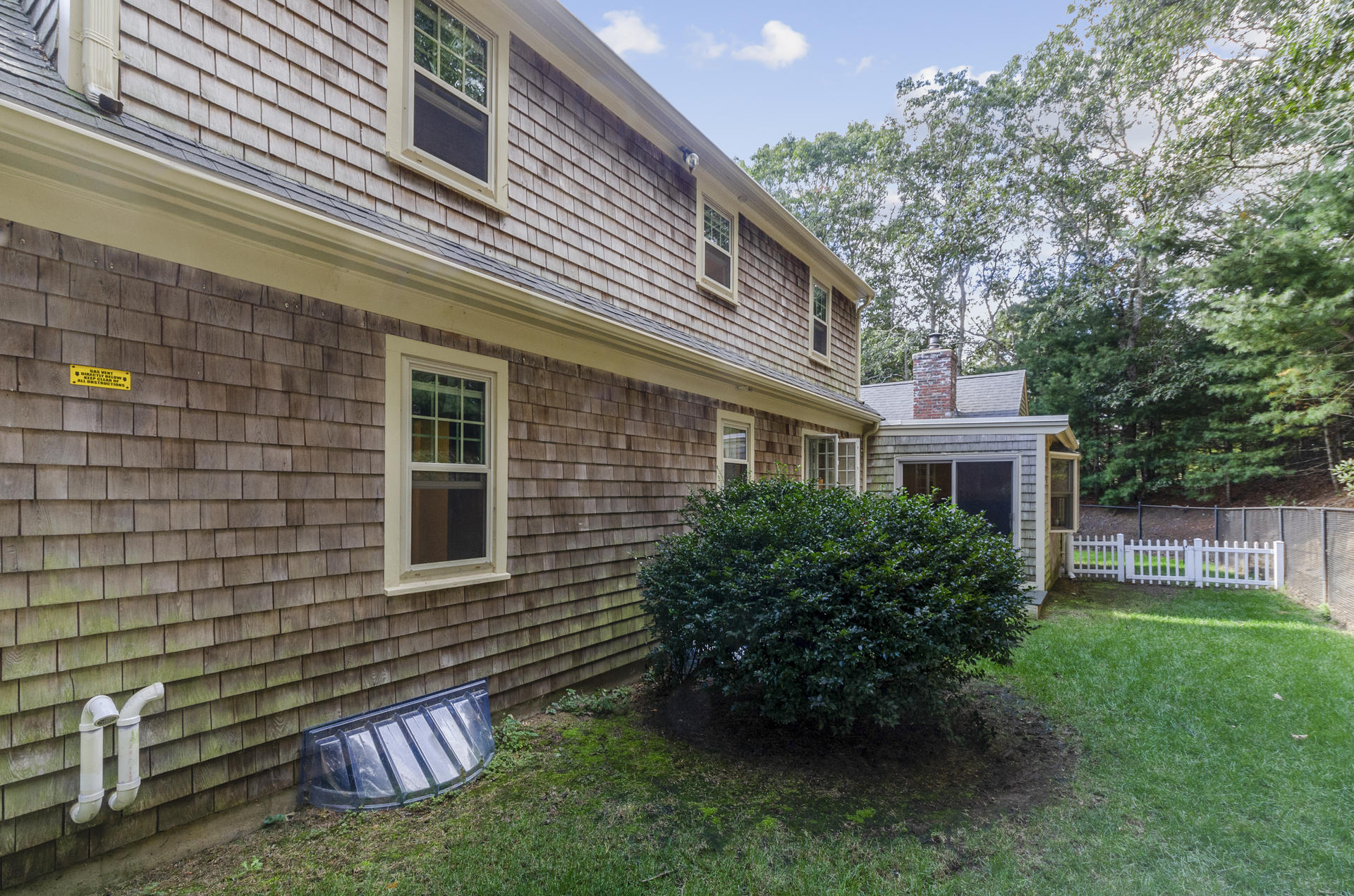 236 Old Mill Road Marstons Mills, MA 02648 - Photo 4 of 20 a front view of a house with garden