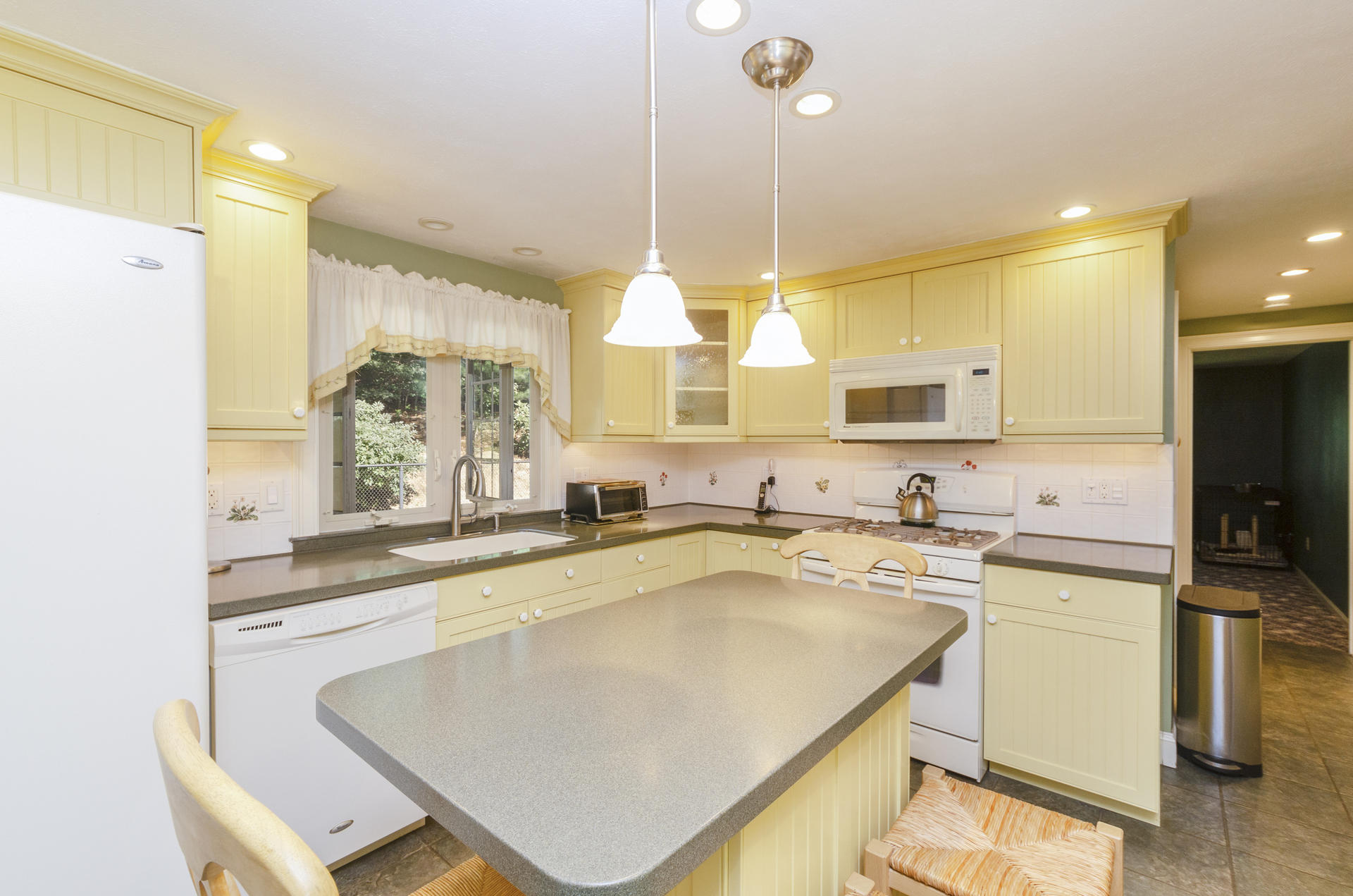 236 Old Mill Road Marstons Mills, MA 02648 - Photo 8 of 20 a kitchen with a sink a window and stainless steel appliances
