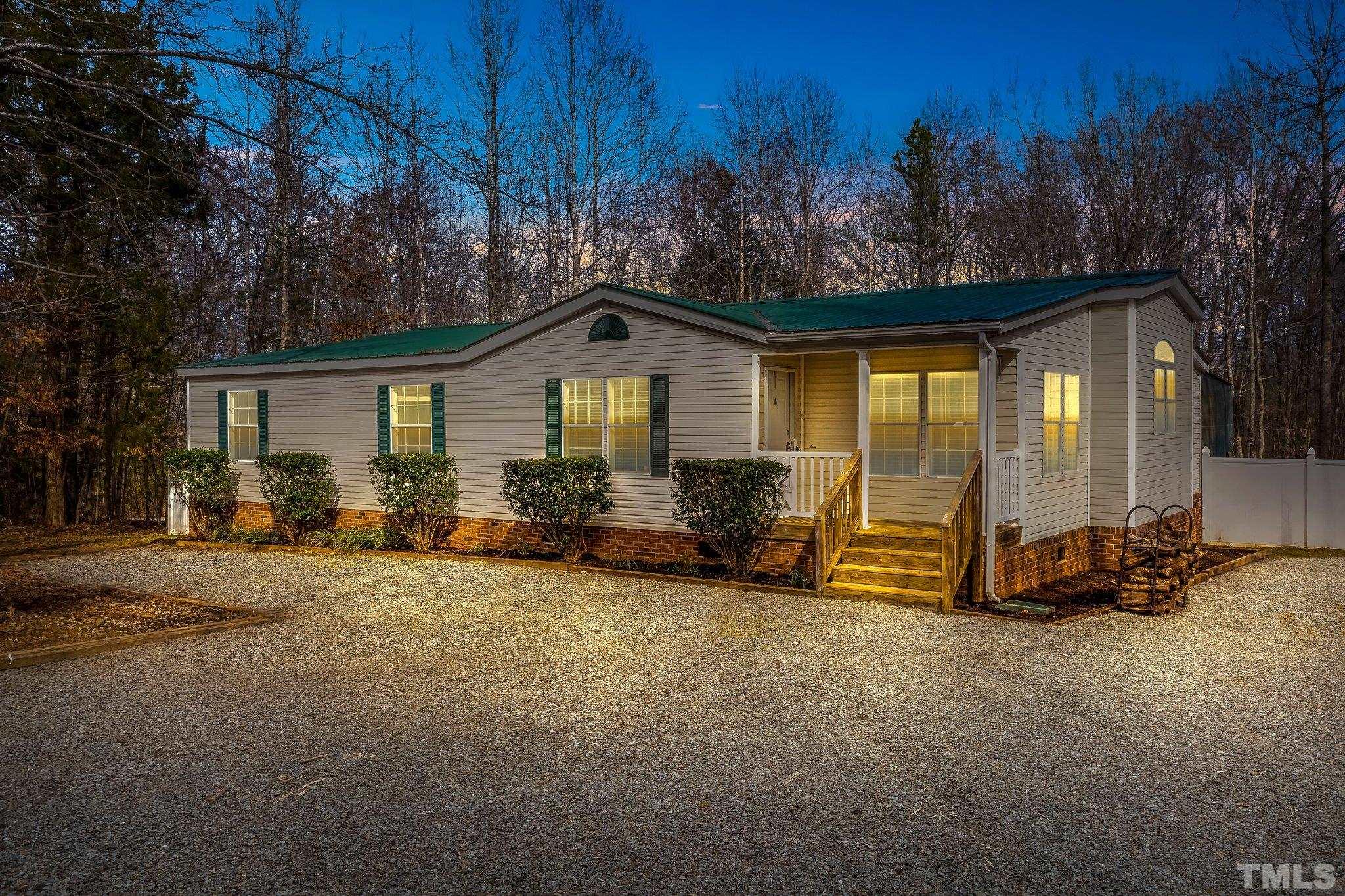 199 New Chestnut Drive Rougemont, NC 27572 - Photo 1 of 28 a view of a house with backyard and garden