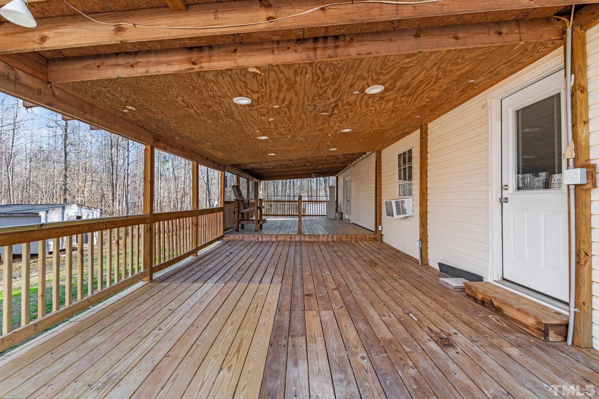 199 New Chestnut Drive Rougemont, NC 27572 - Photo 24 of 28 a view of a balcony with wooden floor
