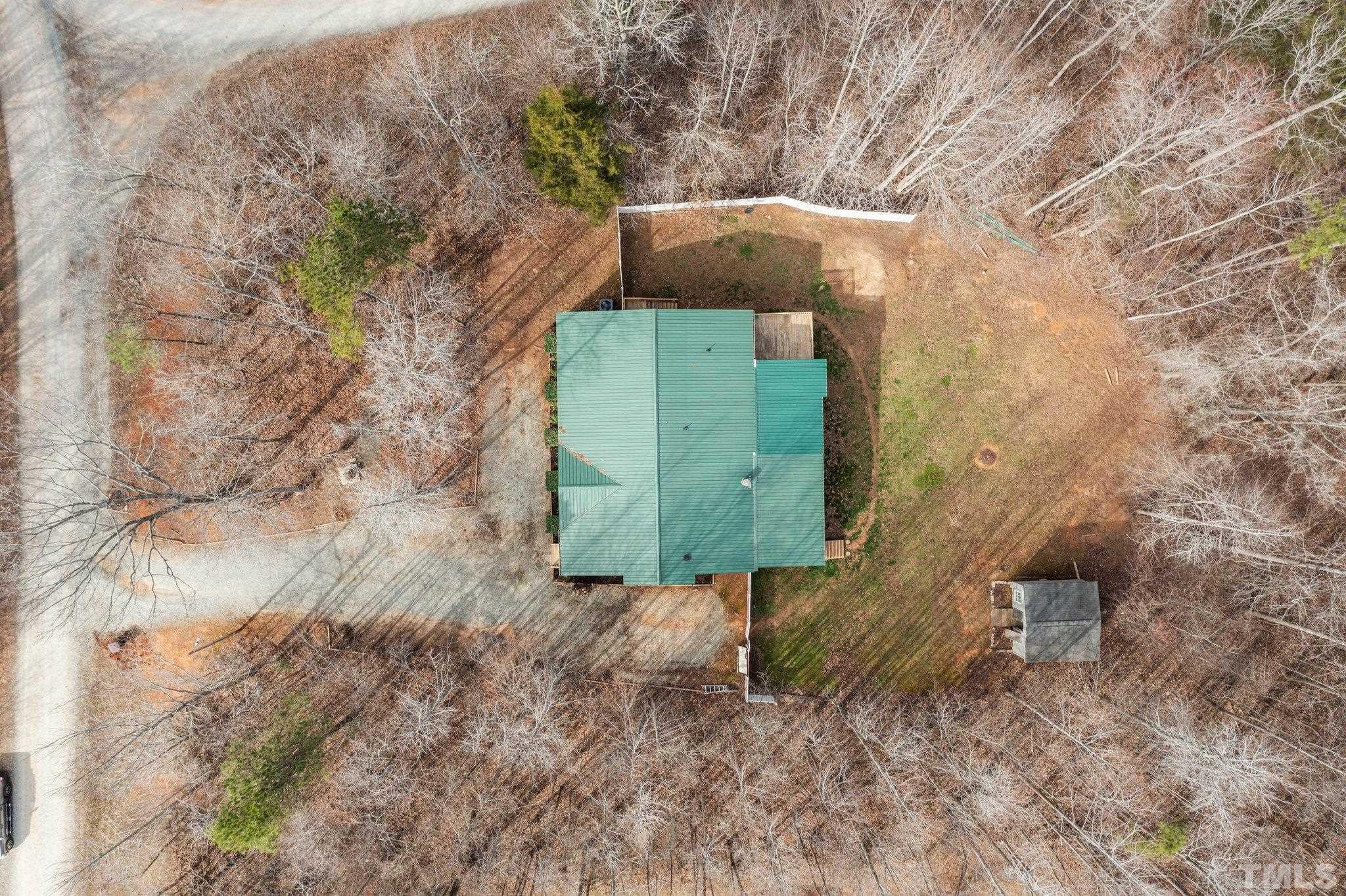 199 New Chestnut Drive Rougemont, NC 27572 - Photo 26 of 28 a green field with trees in the background