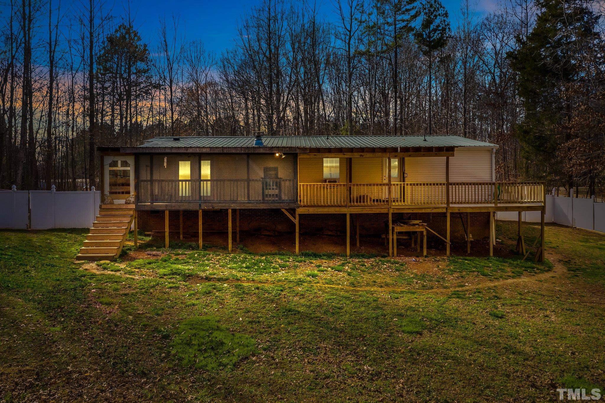 199 New Chestnut Drive Rougemont, NC 27572 - Photo 27 of 28 a view of a house with a yard and sitting area