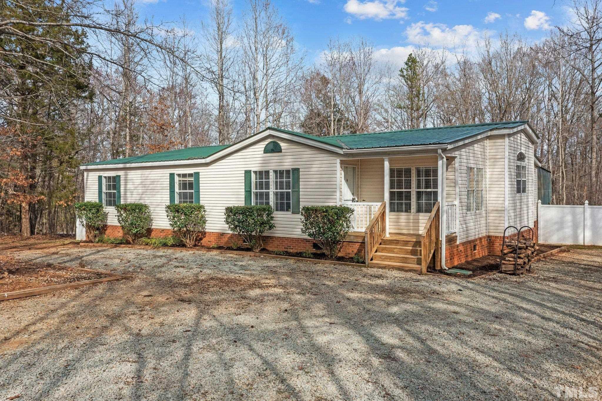199 New Chestnut Drive Rougemont, NC 27572 - Photo 3 of 28 a view of a house with backyard