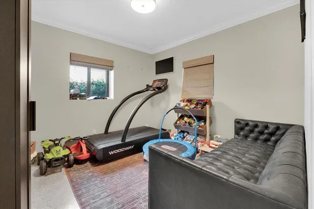 a living room with furniture and a window