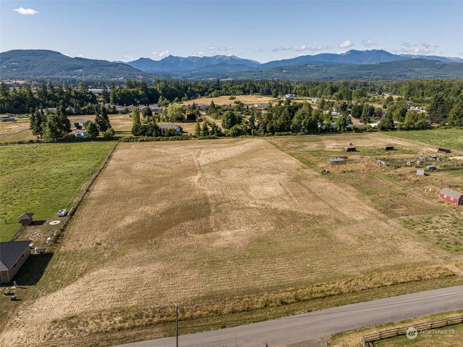 1575 West Hendrickson Road Sequim, WA 98382 - Photo 1 of 16 a view of a mountain with an outdoor space