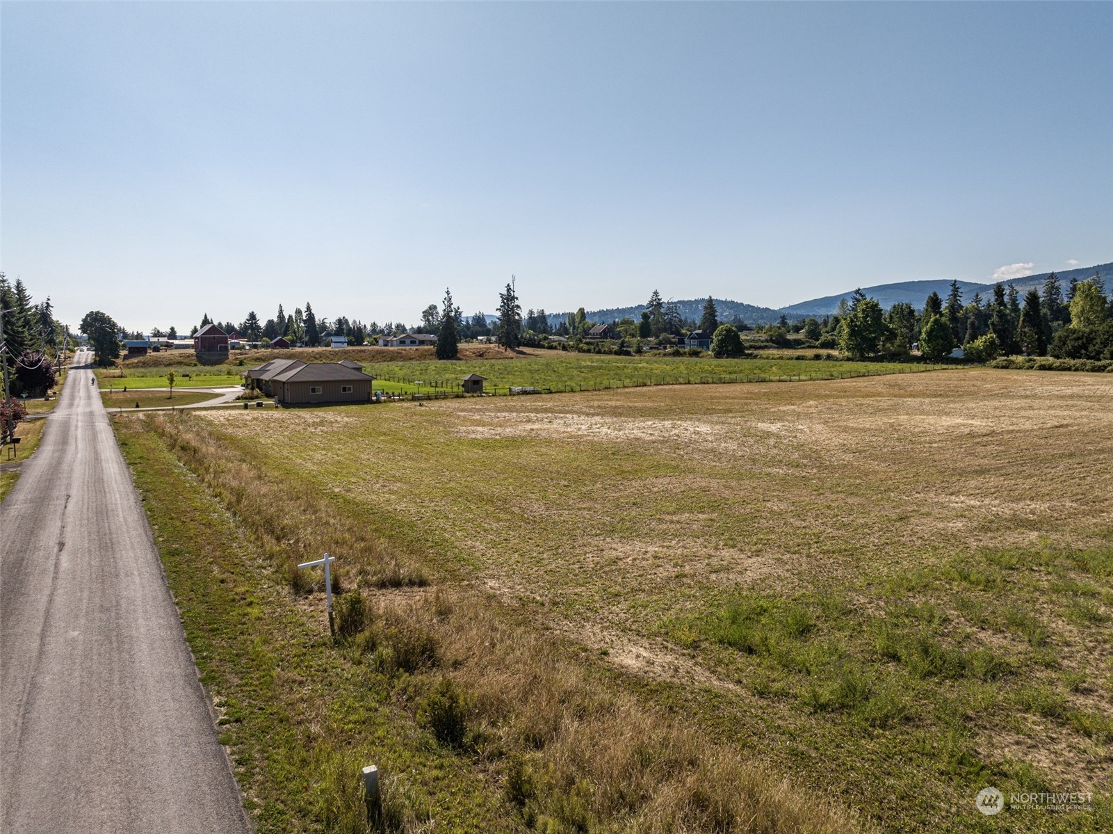 1575 West Hendrickson Road Sequim, WA 98382 - Photo 13 of 16 a view of a lake with houses