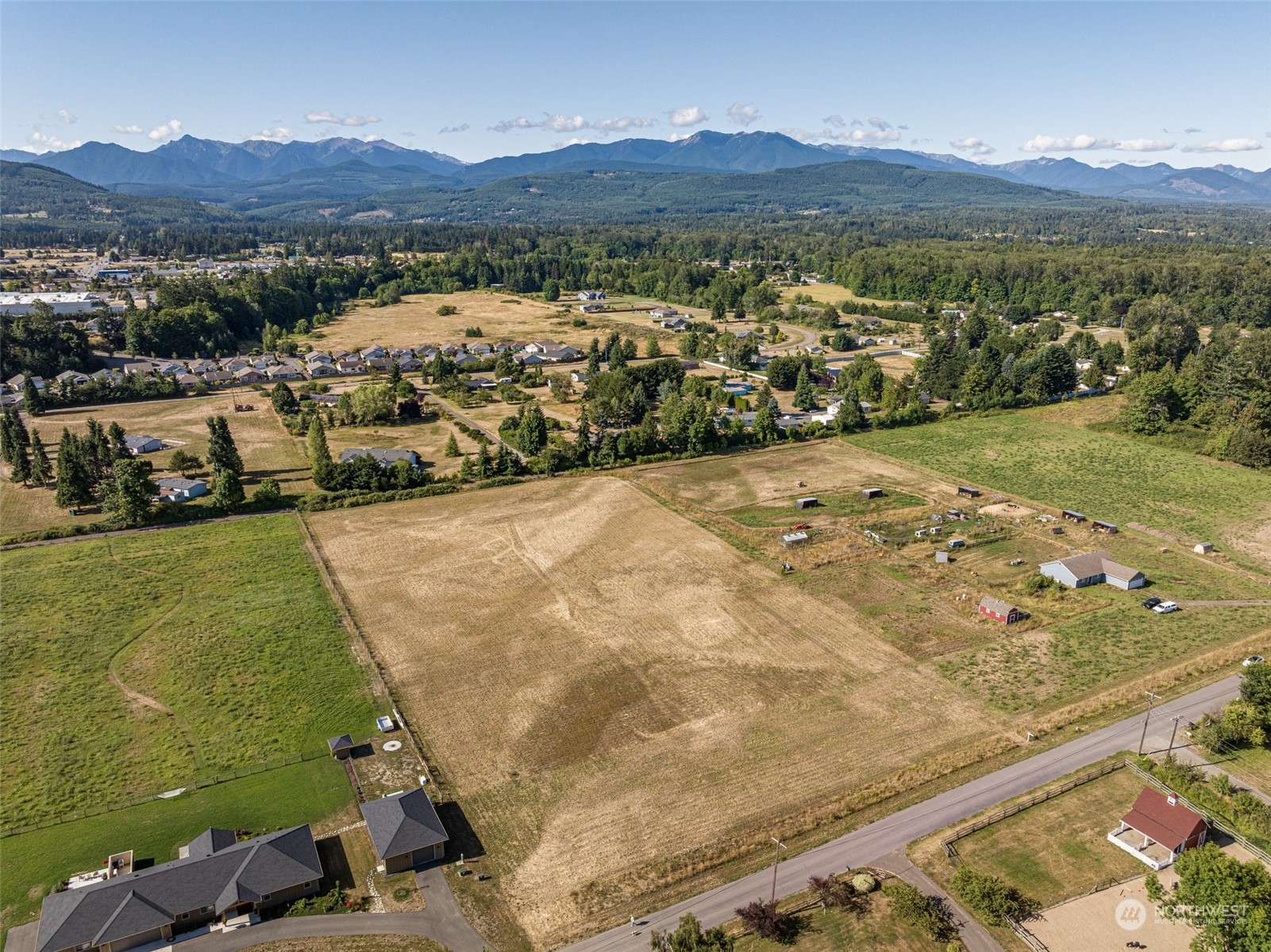 1575 West Hendrickson Road Sequim, WA 98382 - Photo 8 of 16 a view of a mountain with an outdoor space