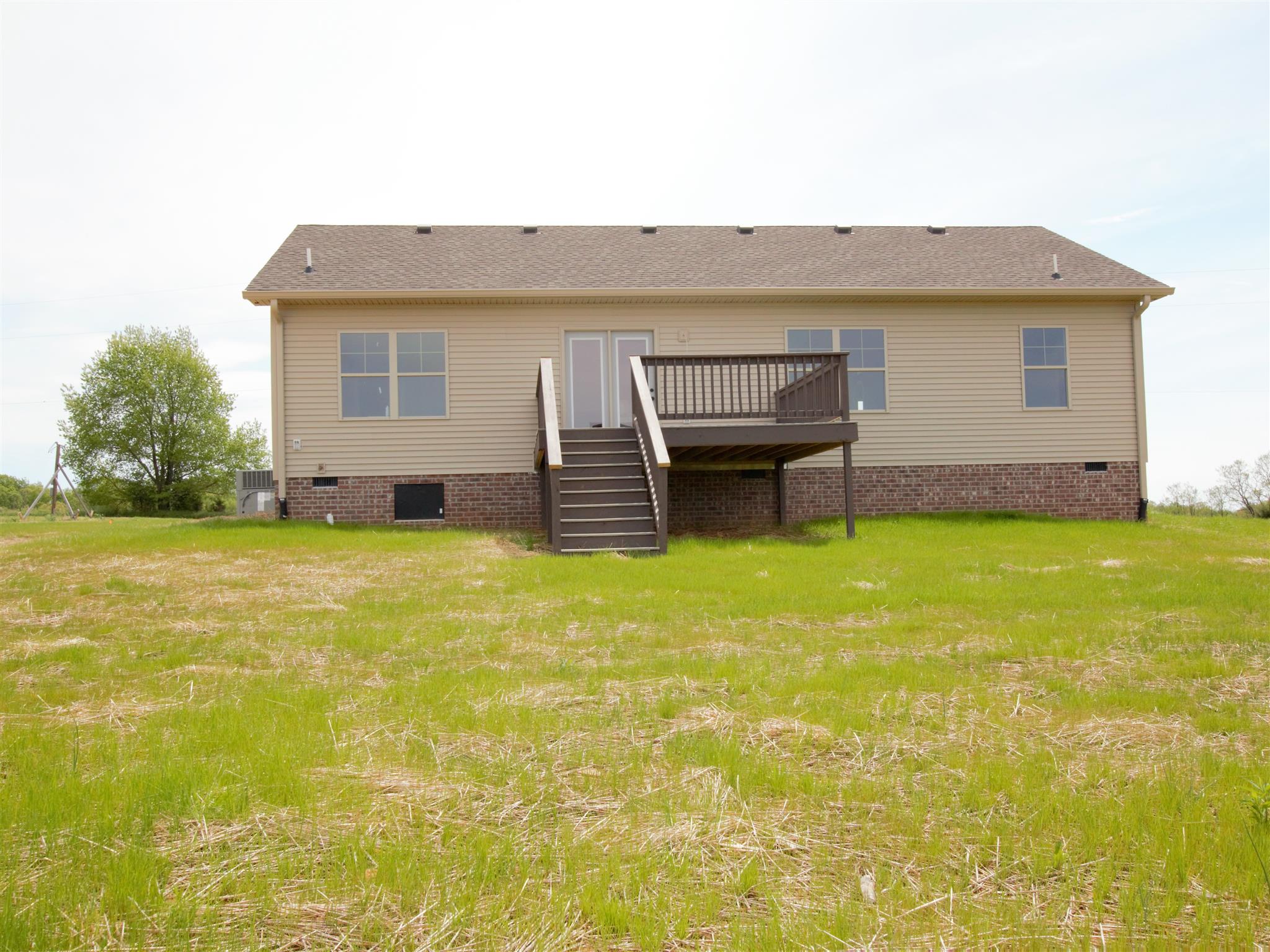 1691 Rapids Road Portland, TN 37148 - Photo 4 of 6 a view of a house with pool and yard