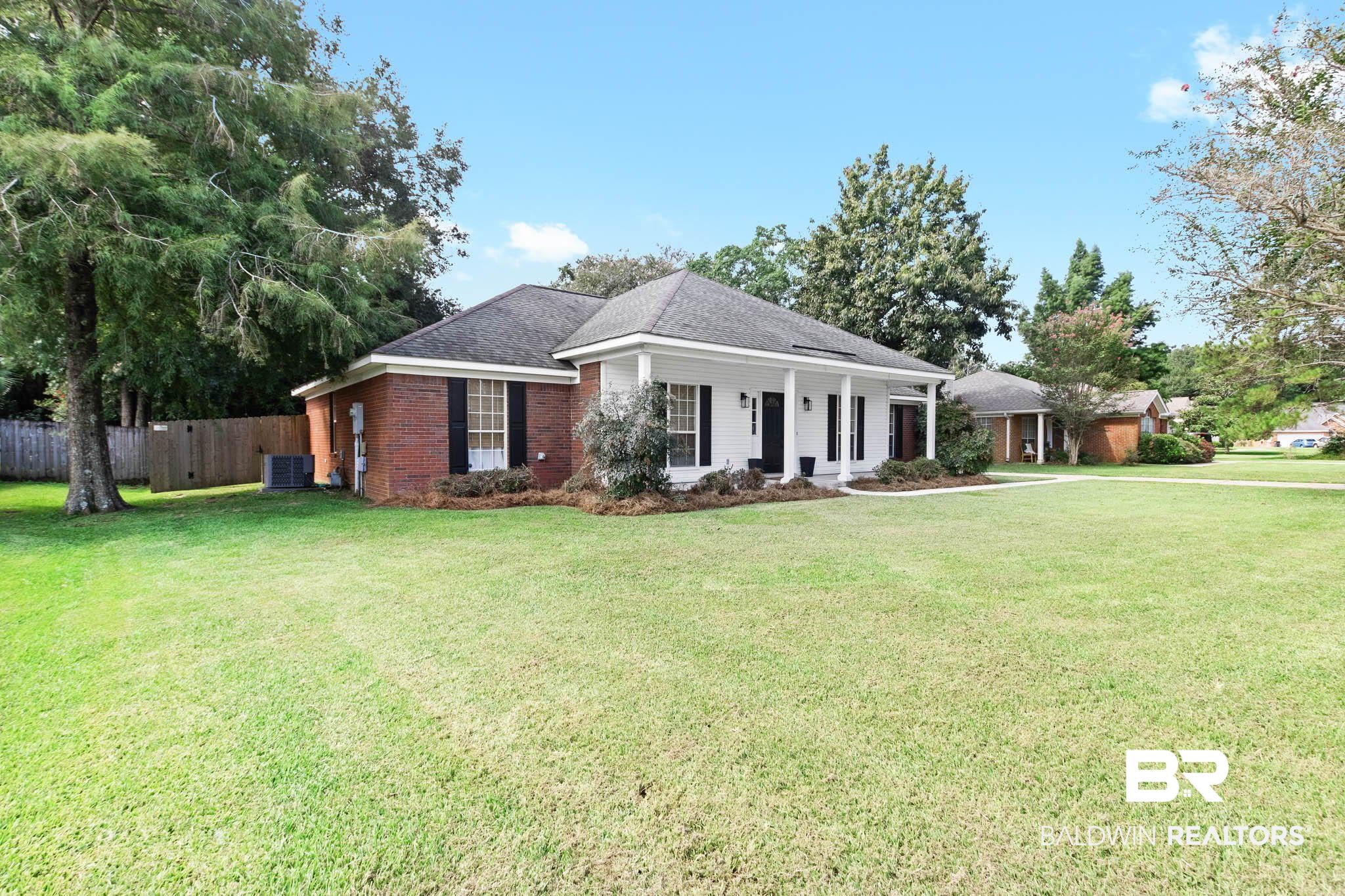 20685 Lowry Drive Fairhope, AL 36532 - Photo 3 of 48 Ranch-style house featuring covered porch, brick siding, and a shingled roof