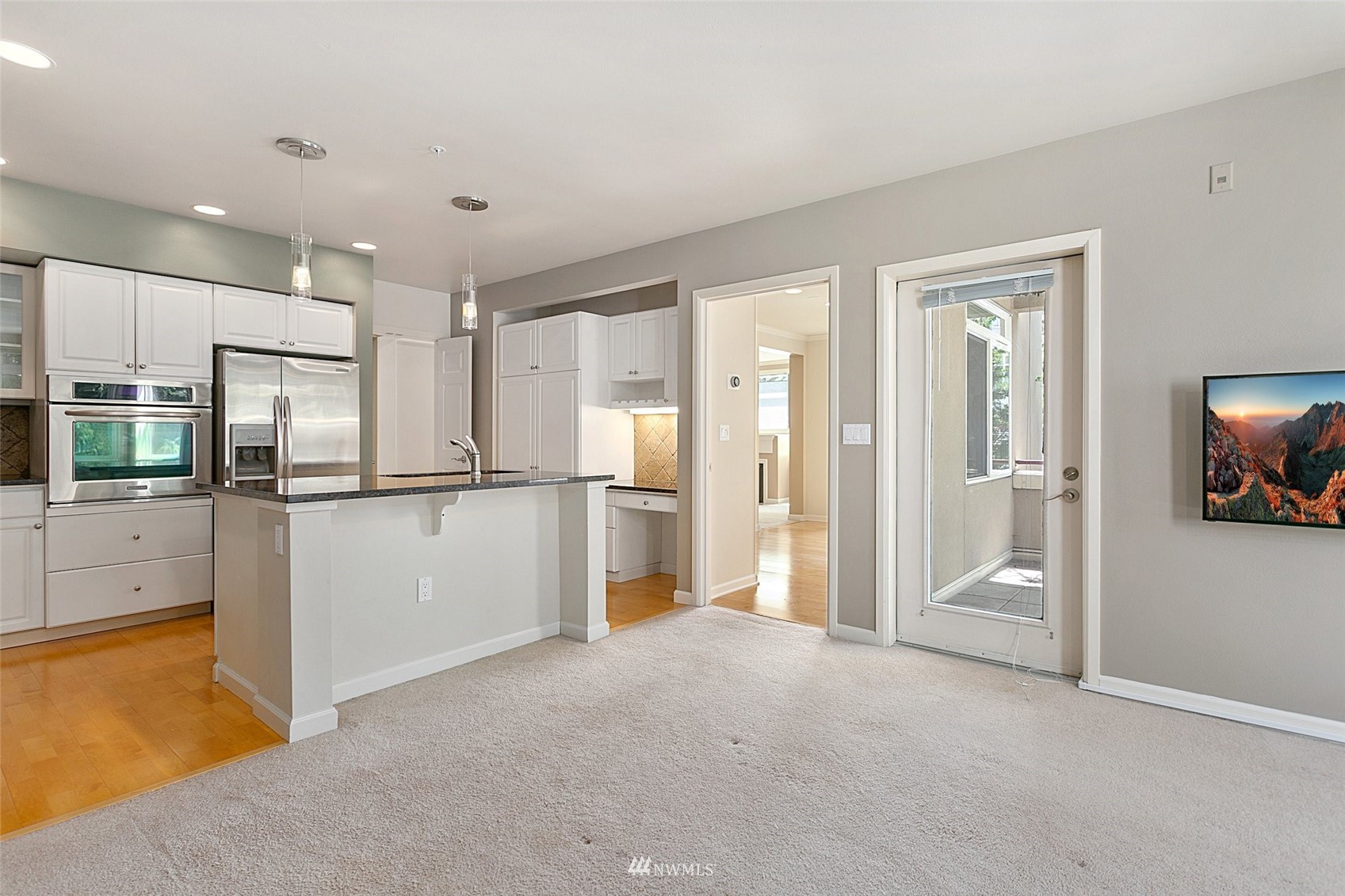 102 State Street, Unit 101W Kirkland, WA 98033 - Photo 12 of 38 a view of empty room with a kitchen