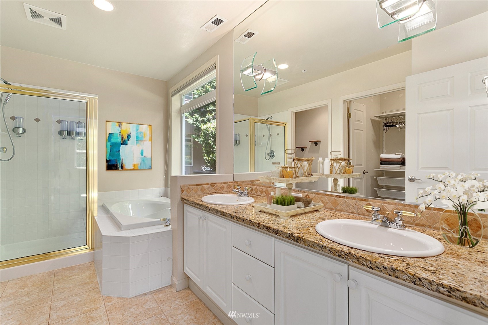 102 State Street, Unit 101W Kirkland, WA 98033 - Photo 21 of 38 a bathroom with a granite countertop sink and a bathtub