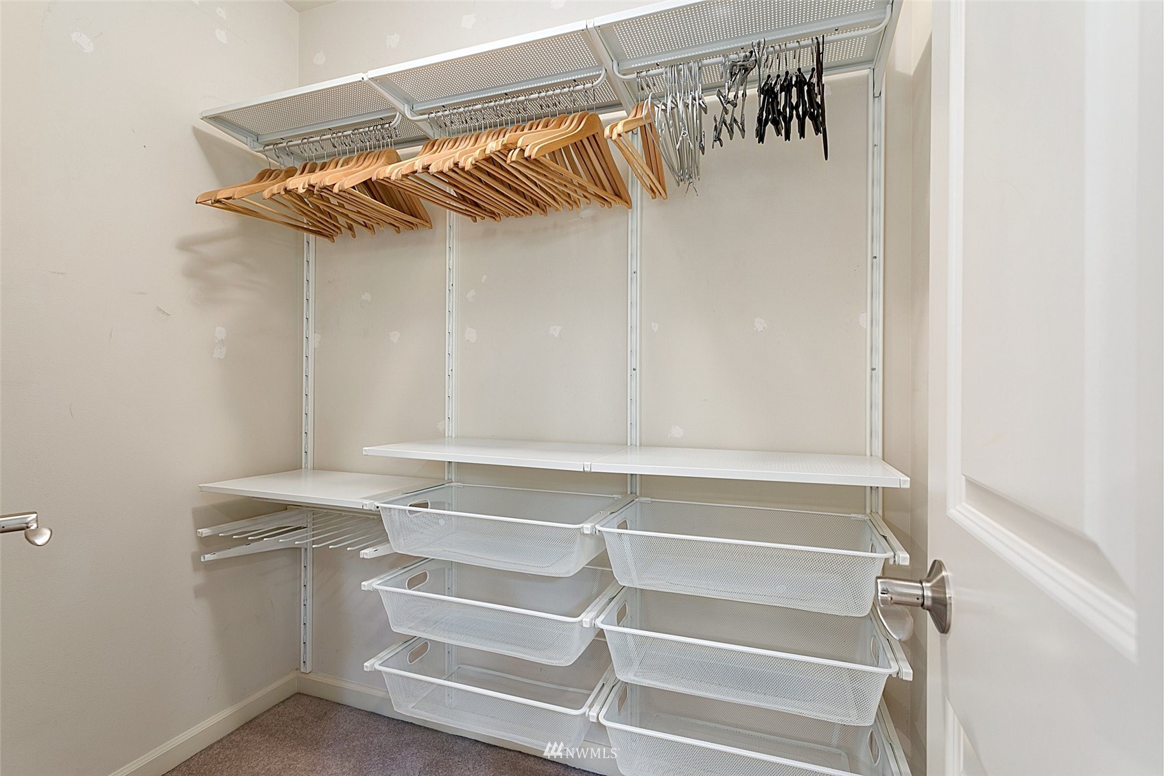 102 State Street, Unit 101W Kirkland, WA 98033 - Photo 22 of 38 a view of walk in closet with empty racks
