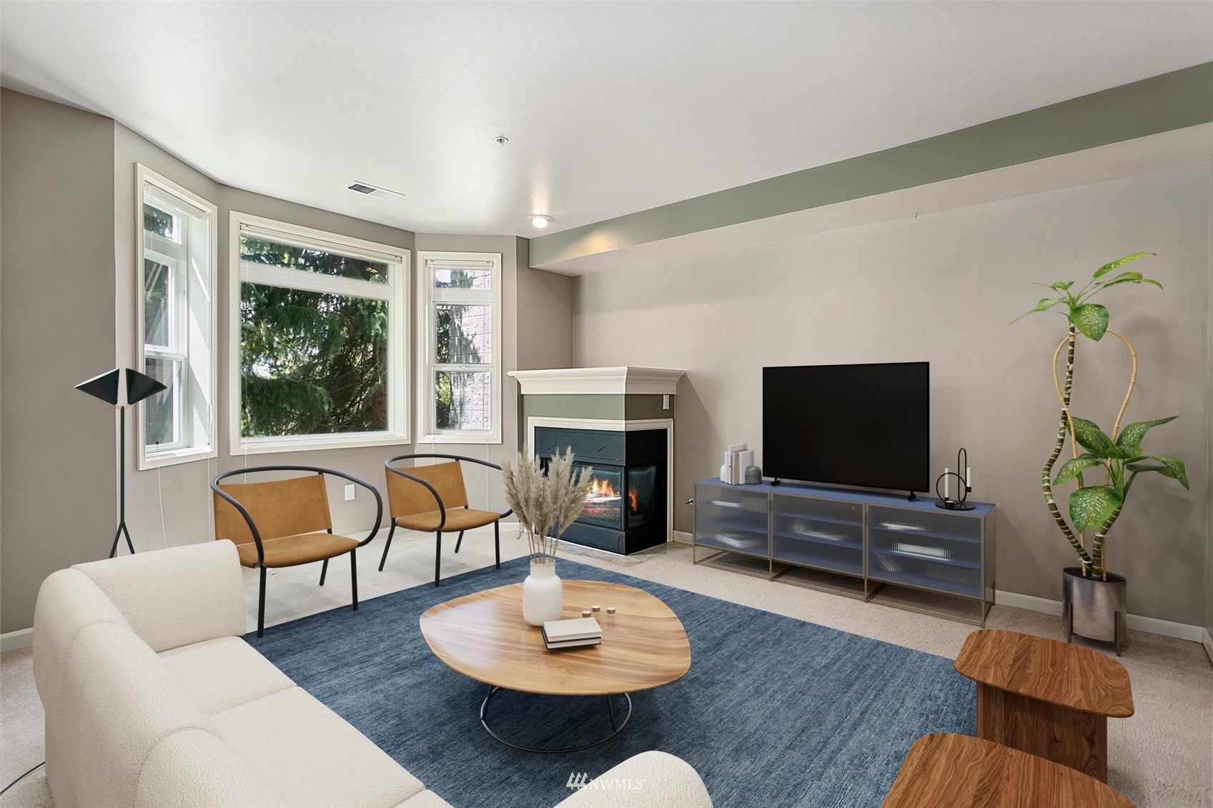 102 State Street, Unit 101W Kirkland, WA 98033 - Photo 10 of 38 a living room with furniture a flat screen tv and a large window