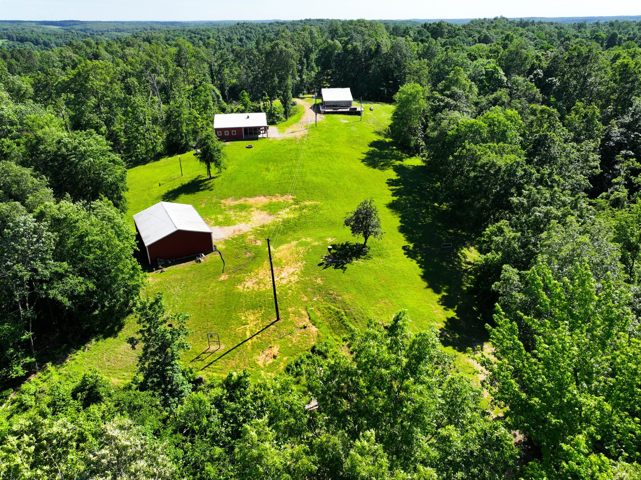 326 Hargis Road Bumpus Mills, TN 37028 - Photo 11 of 67 an aerial view of residential house with outdoor space and trees all around