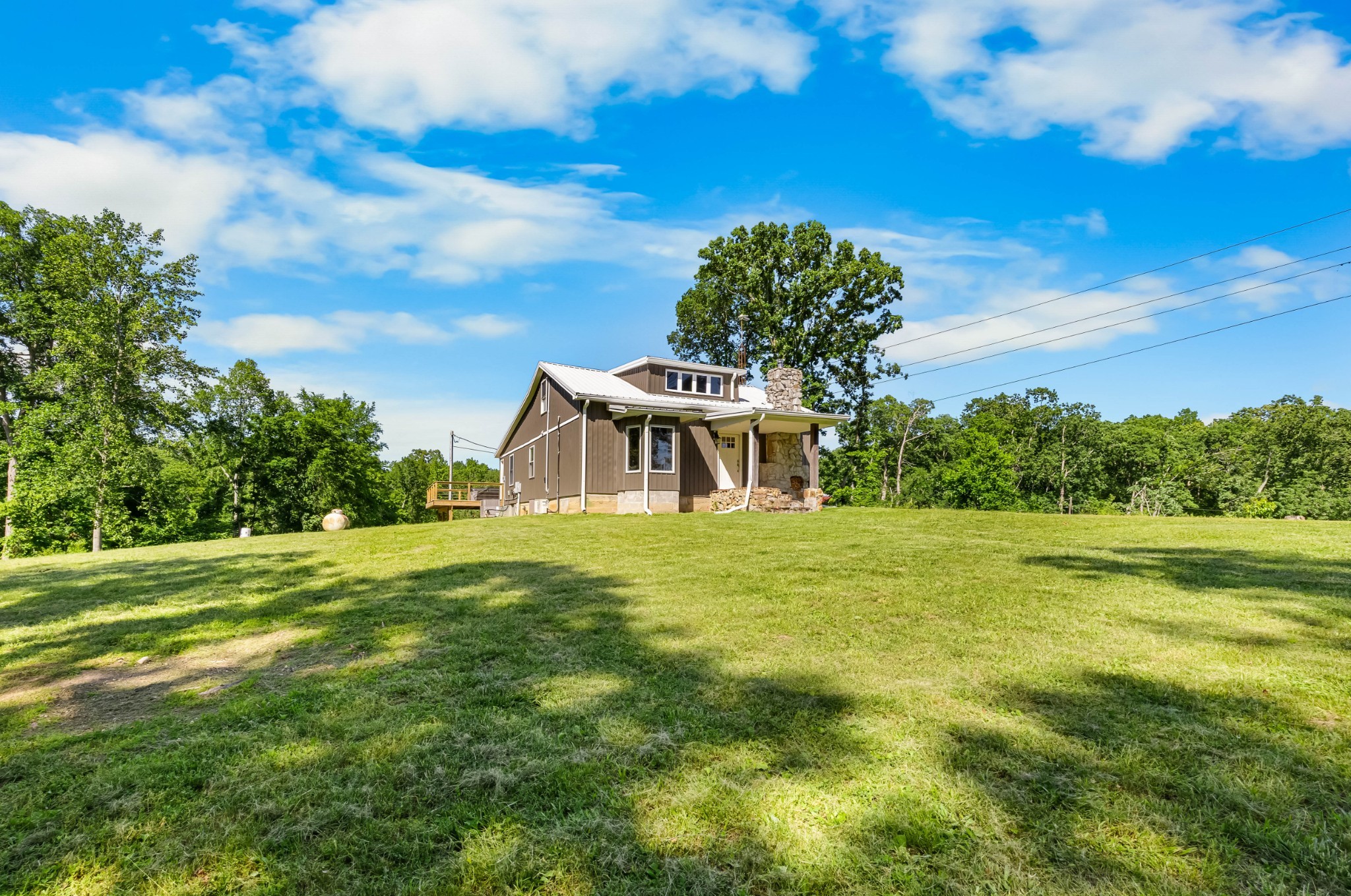 326 Hargis Road Bumpus Mills, TN 37028 - Photo 16 of 67 a front view of a house with a garden