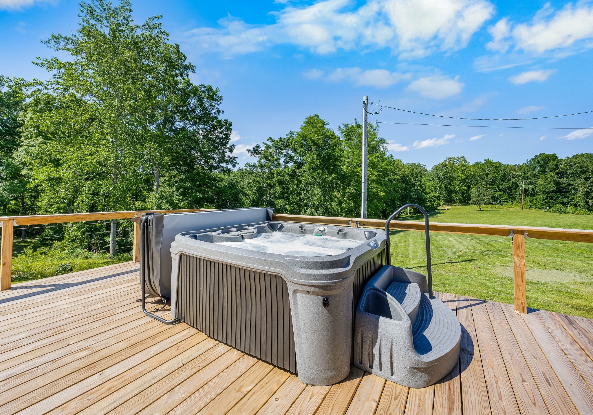326 Hargis Road Bumpus Mills, TN 37028 - Photo 50 of 67 a view of a balcony with two chairs and a table