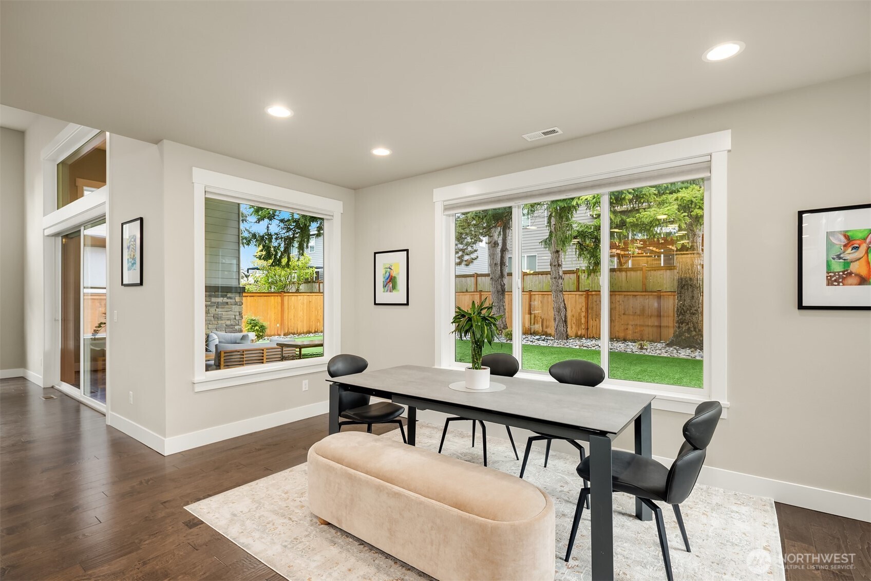 1435 242nd Place Southeast Bothell, WA 98021 - Photo 14 of 40 a dining room with furniture a chandelier and wooden floor