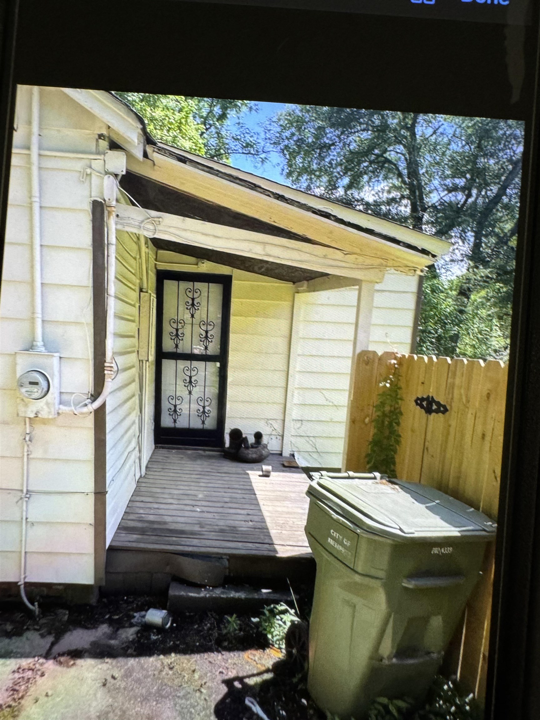 3483 Ardmore Street Memphis, TN 38127 - Photo 4 of 13 a front view of a house with parking