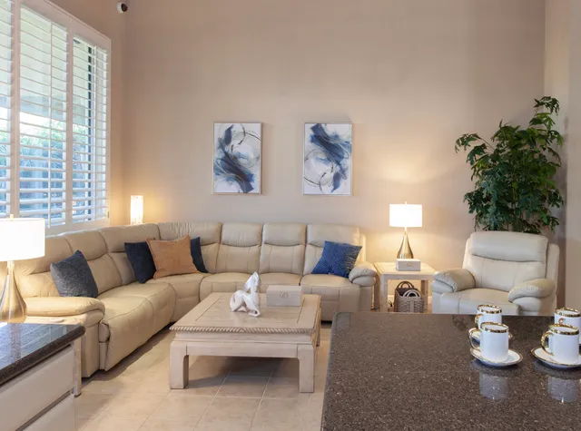 a kitchen with a sink a stove and cabinets