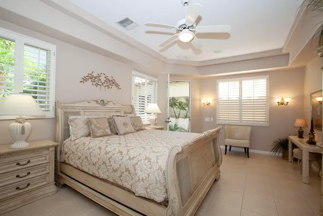 a kitchen with stainless steel appliances kitchen island granite countertop a refrigerator and a stove top oven