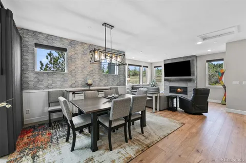 a view of a dining room with furniture window and wooden floor