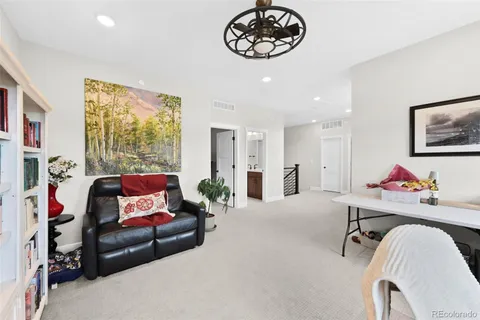a view of a livingroom with furniture and windows