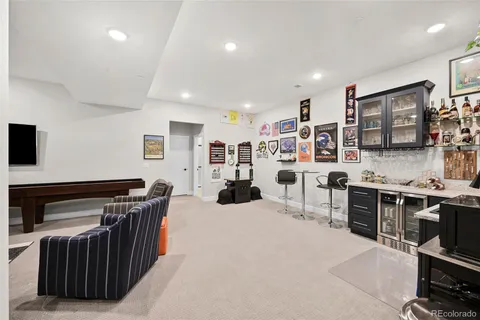 a large kitchen with stainless steel appliances granite countertop a stove and a refrigerator