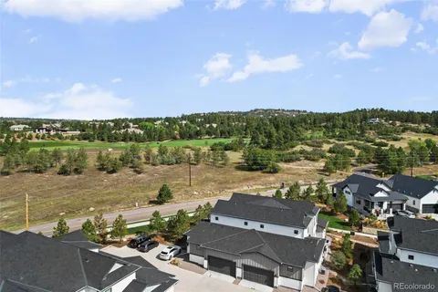 an aerial view of a house with a lake view