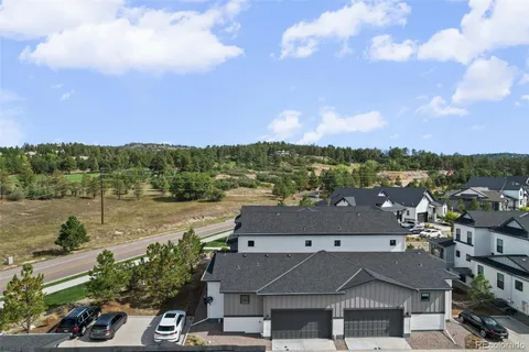 an aerial view of a house with a lake view