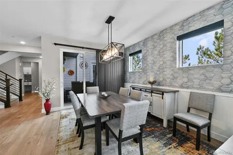 a view of a dining room with furniture window and wooden floor