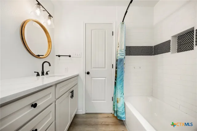 a bathroom with a sink and a bathtub