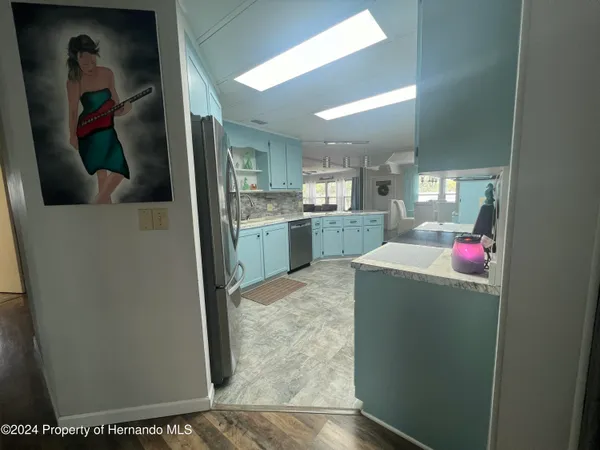 a bedroom with a bed and walk in closet
