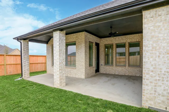 a view of house with backyard
