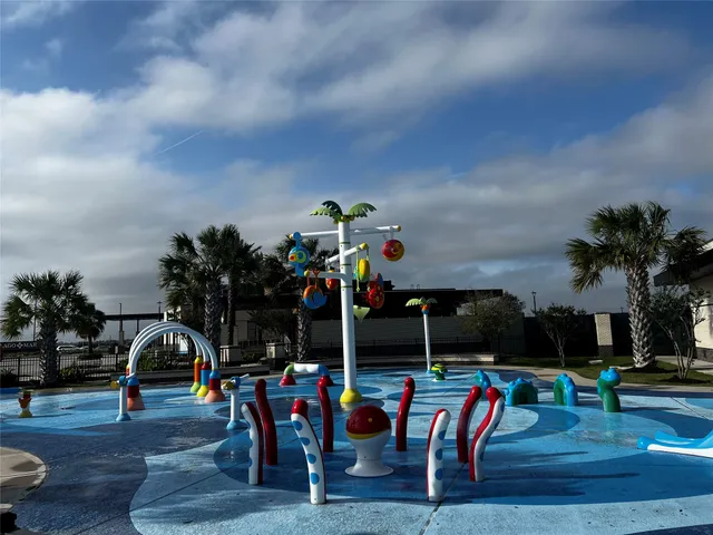a front view of a house with a garden and patio