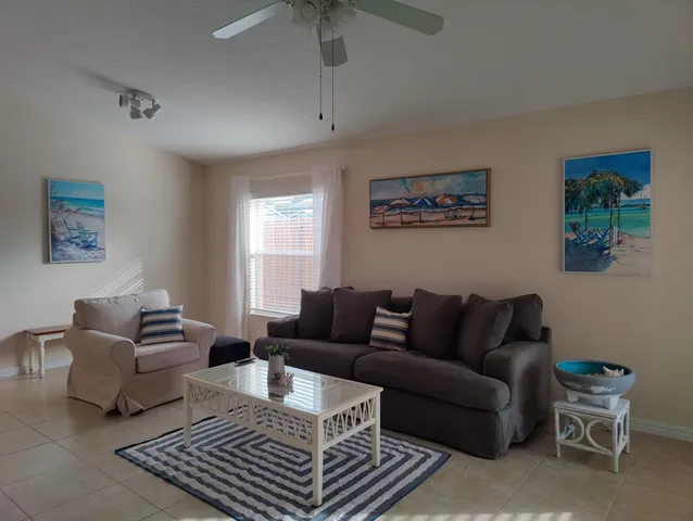 a living room with furniture and a rug