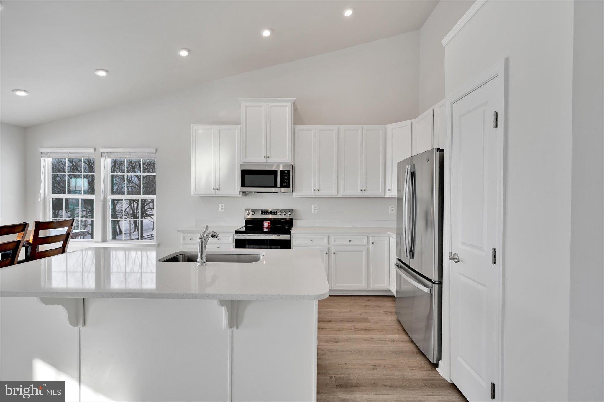 415 Courtland Road Atglen, PA 19310 - Photo 3 of 26 a kitchen with stainless steel appliances a refrigerator sink and microwave