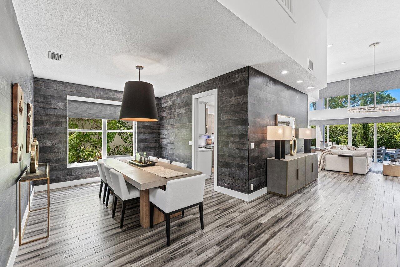 3395 Northwest 53rd Circle Boca Raton, FL 33496 - Photo 5 of 64 a view of a dining room with furniture window and wooden floor