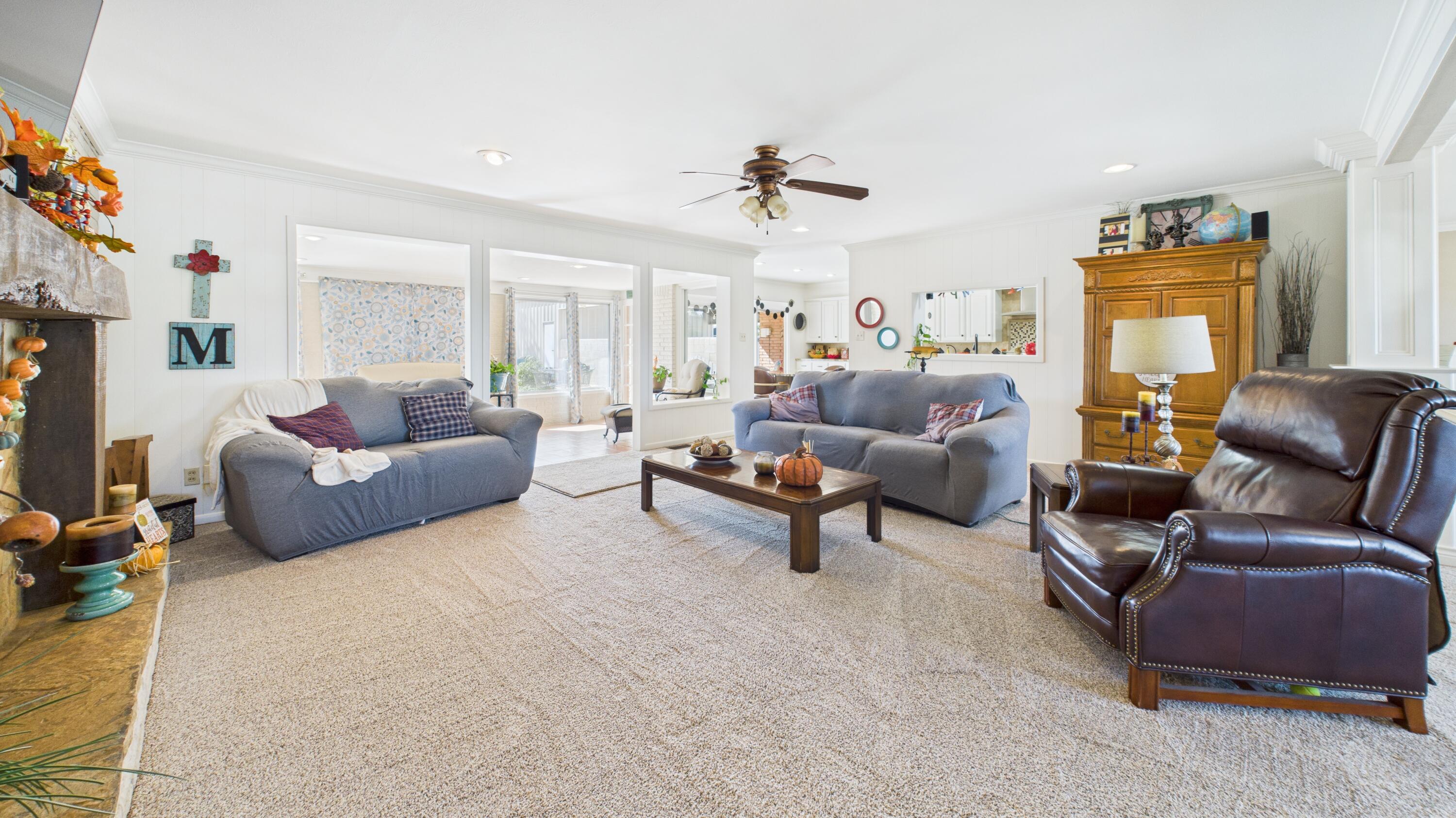 609 North 21st Street Lamesa, TX 79331 - Photo 15 of 50 a living room with furniture and a flat screen tv