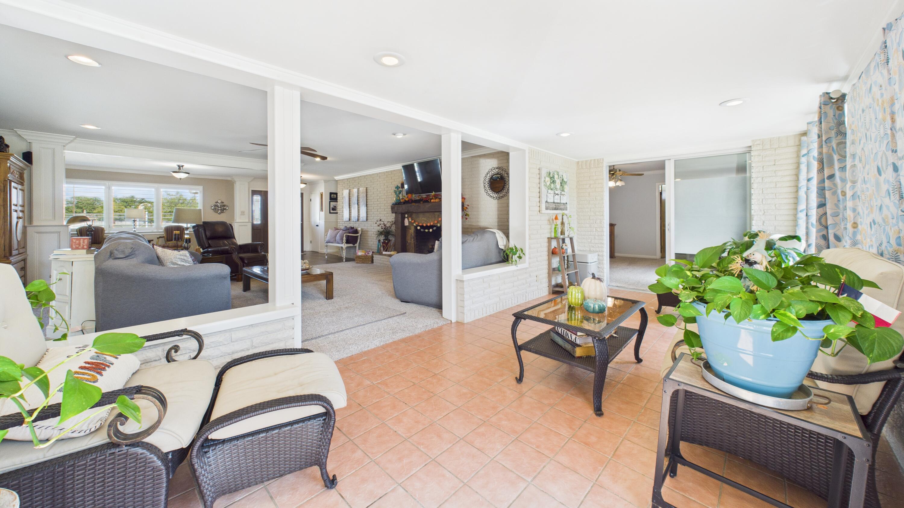 609 North 21st Street Lamesa, TX 79331 - Photo 48 of 50 a living room with patio furniture and a potted plant
