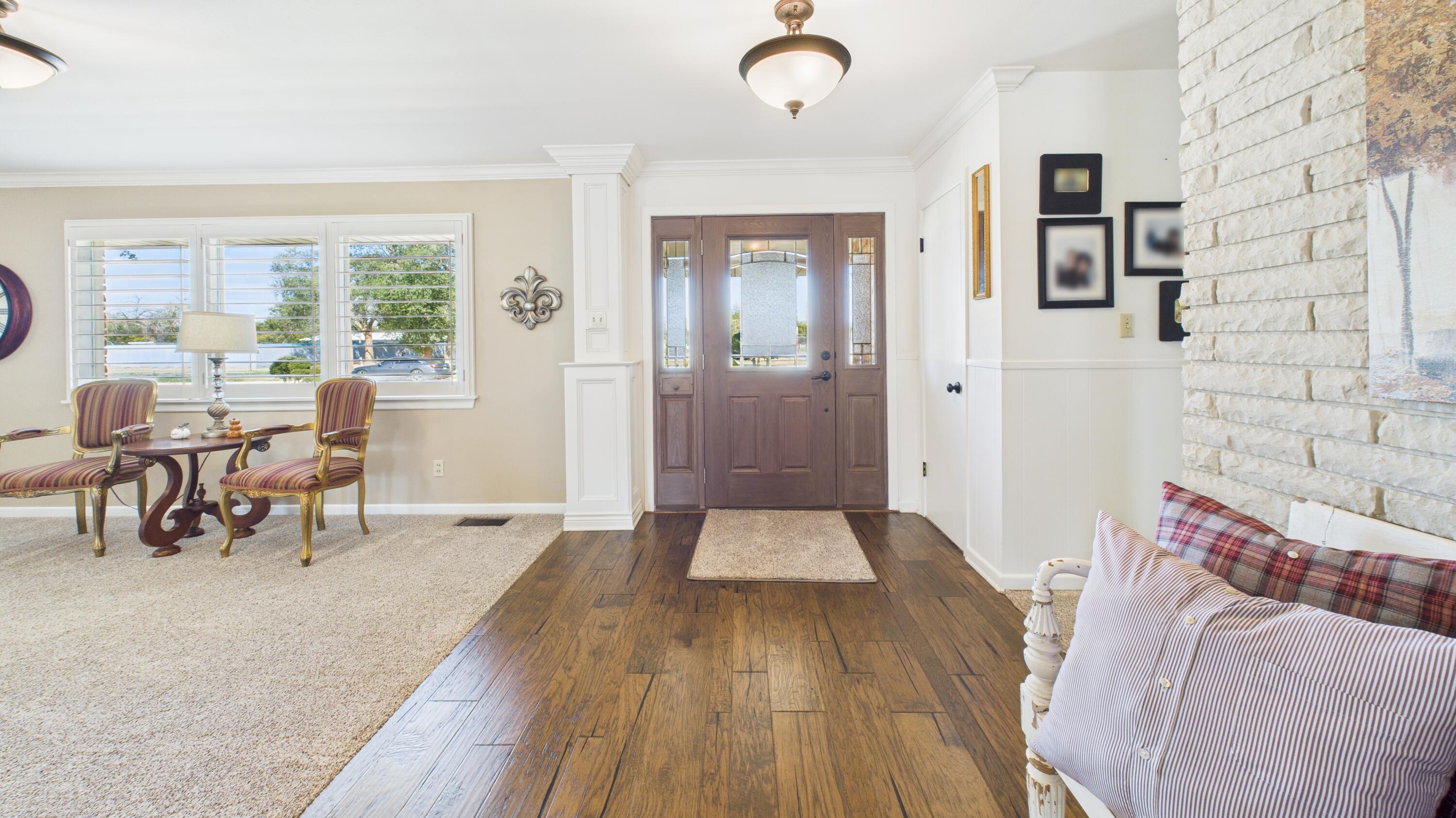 609 North 21st Street Lamesa, TX 79331 - Photo 5 of 50 a view of a livingroom with furniture window and wooden floor