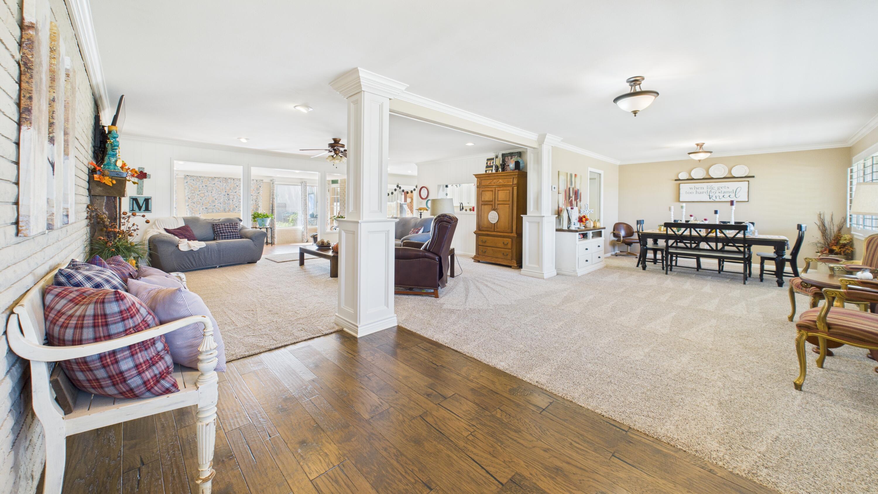 609 North 21st Street Lamesa, TX 79331 - Photo 7 of 50 a living room with furniture and wooden floor