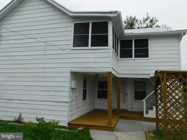 a front view of a house with a porch