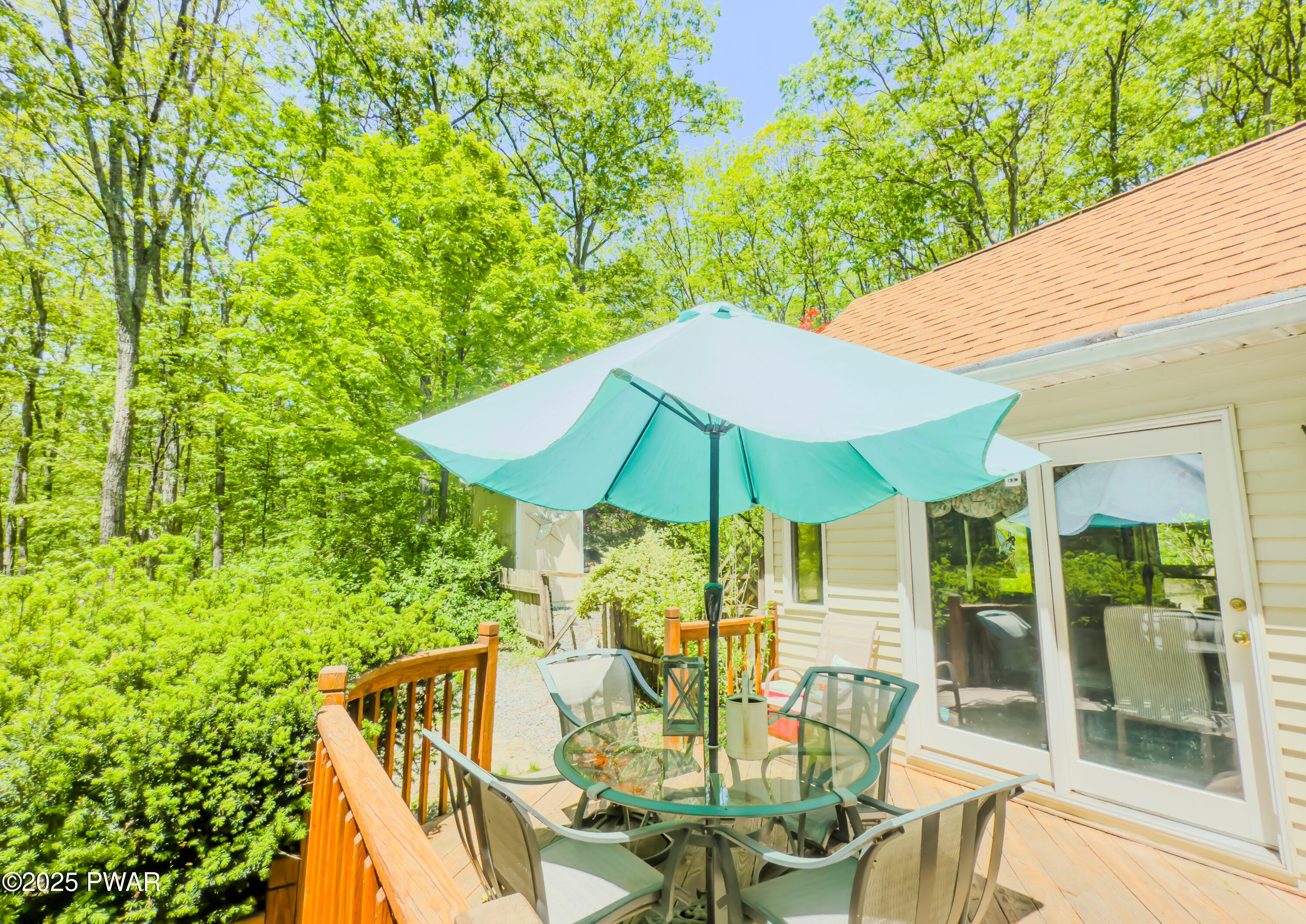 516 Lake Road Hawley, PA 18428 - Photo 8 of 28 a view of balcony with outdoor seating and green space