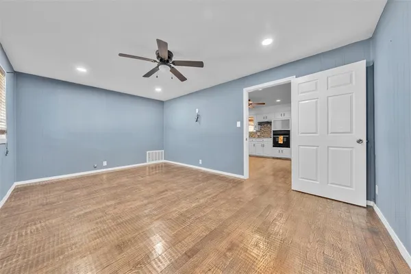 a view of a livingroom with a kitchen