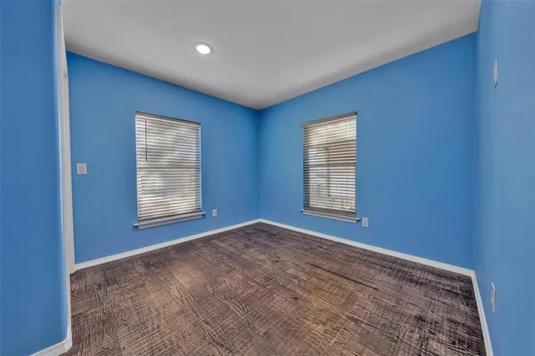 a view of empty room with windows
