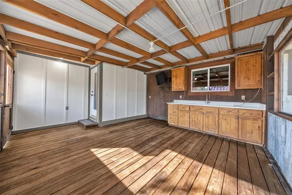 a view of a balcony with wooden floor