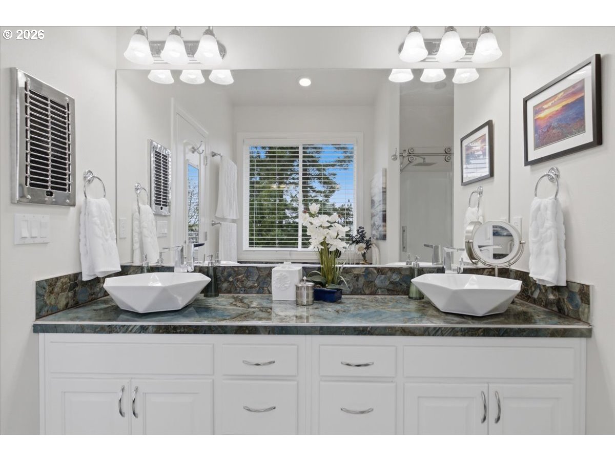 2469 Dalke Ridge Drive Northwest Salem, OR 97304 - Photo 18 of 42 a bathroom with a granite countertop sink a mirror and a bathtub